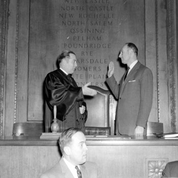 Edwin G. Michaelian taking the oath of office for Westchester County Executive, 1958 (PMC-119)