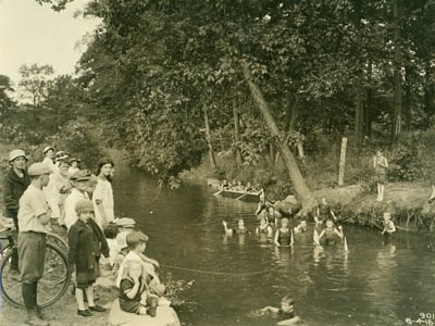 Children swimming and canoeing in the Bronx River, 4 August 1916 (PBP-901, Album 14)