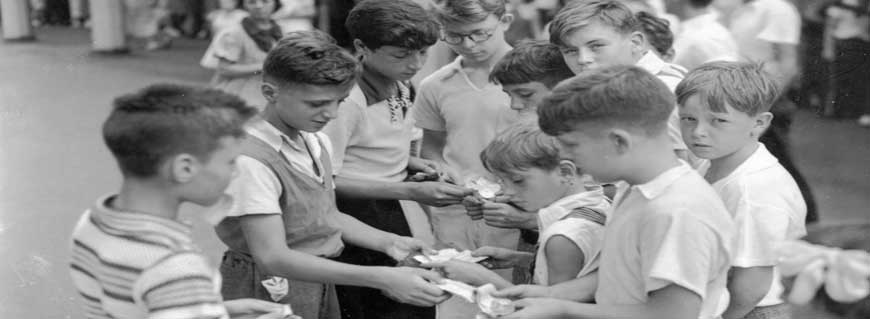 Boys counting scrip trickets at Playland, ca. 1930 (PPL 5634)